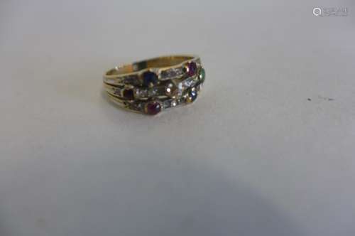 A pretty Edwardian 18ct gold ring set with 23 diamonds, three rubies , two sapphires and an emerald,