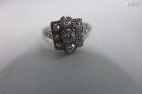 A very pretty 18ct white gold and platinum diamond ring, the central stone of approx 0.25cts