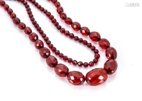 A cherry amber style graduated faceted bead necklace, 84cm, together with another uniform faceted