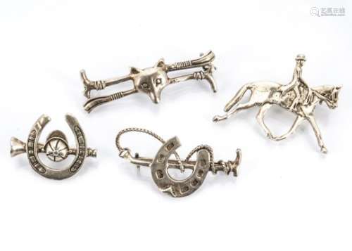 Four silver equestrian themed brooches, comprising three bar brooches decorated with riding crops,