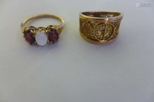 A 9ct garnet and opal three stone ring, size K 1/2 weight approx 2.2 grams, and a gold filigree