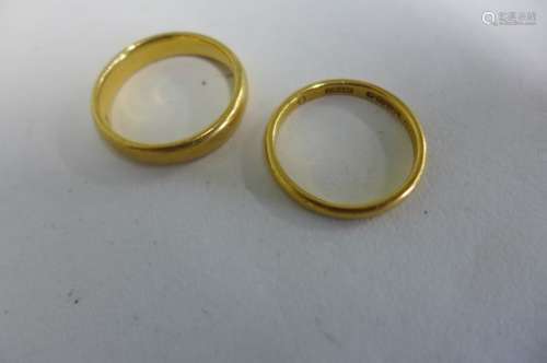 Two 22ct wedding bands, sizes P and N 1/2 - 9.6 grams, some surface marks