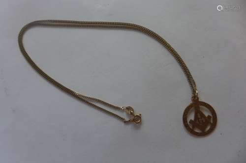 A 9ct yellow gold masonic pendant and a 9ct chain, total weight approx 4 grams