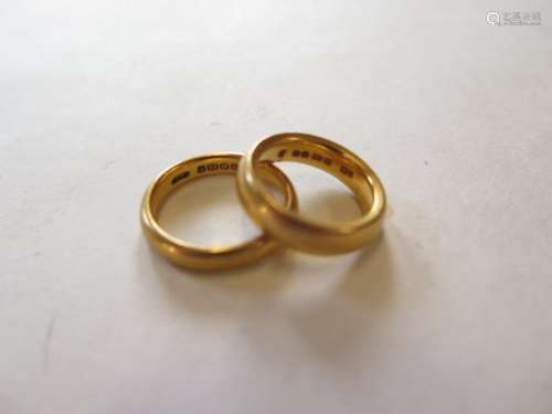 Two 22ct yellow gold band rings, sizes O and J, total weight approx 16.7 grams