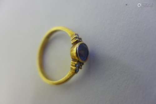 An 18ct yellow gold ceylon sapphire and diamond ring, set with an oval sapphire, approx 6x5mm with