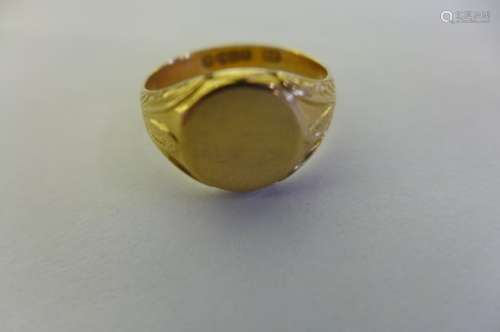 An 18ct gold signet ring, weight approx 4.4 grams, size U 1/2 - some wear, dents to top