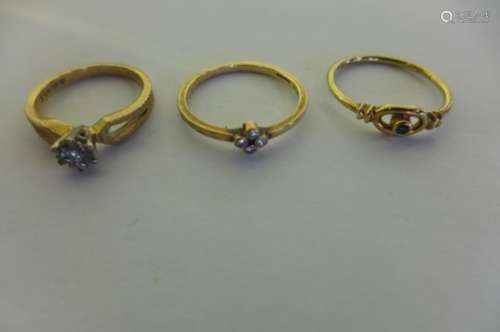 Three 9ct gold rings, two set with small diamonds, sizes N 1/2 and K and one with small sapphire,