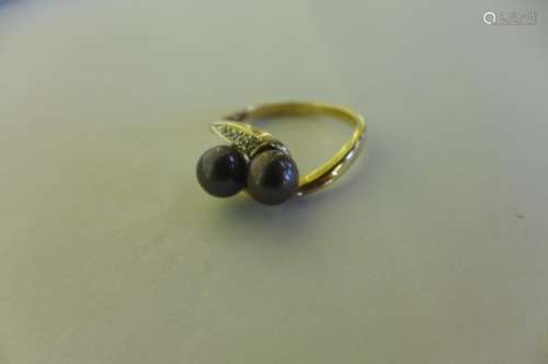 A 9ct black pearl and diamond crossover ring, size S, approx weight 3.26 grams, very good condition