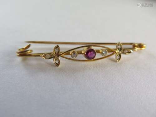 A 9ct yellow gold diamond and ruby brooch, 5cm long in good condition 2.8 grams