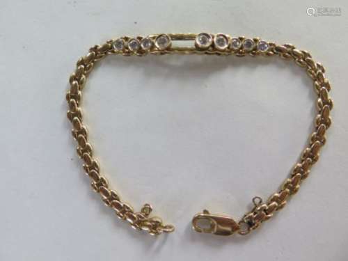 An 18ct yellow gold diamond bracelet set with nine collet mounted diamonds, 20cm long, approx 12.4