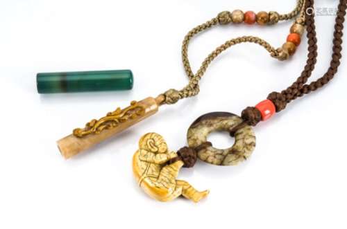 A collection of Chinese agate, jade and hardstone pendants, comprising a blue agate desk seal, a