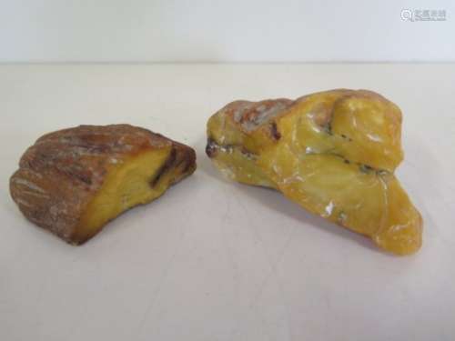 Two large pieces of amber - 10x5x6cm and 4x7x4cm - approx 209 grams