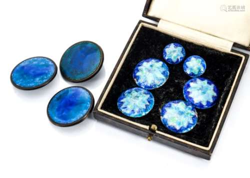 A set of four copper and enamel buttons, two smaller dress buttons and three mottled blue buttons