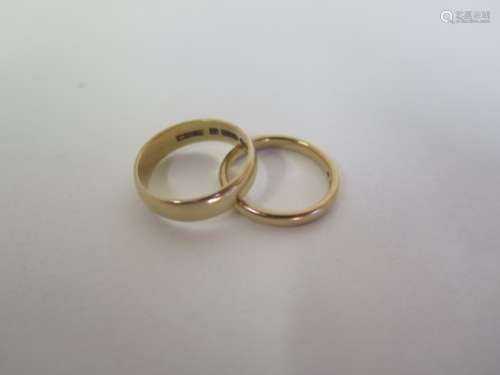 Two 9ct yellow gold band rings, sizes M/O, total approx 5.8 grams