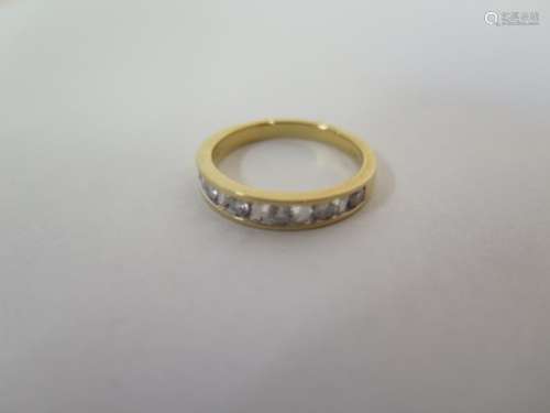 An 18ct yellow gold six stone diamond ring, size O, approx 3.8 grams, in generally good condition
