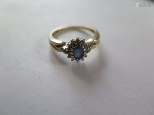A 15ct yellow gold sapphire and diamond cluster ring, size R, approx 3.5 grams