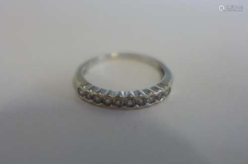 An 18ct white gold, ten stone diamond ring, approx total 0.25ct ,ring size L, approx 2 grams