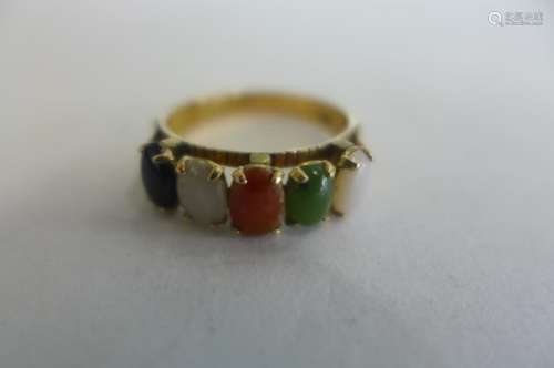 A 9ct gold five stone multi gem hard stone ring, size M, approx 2.5 grams - some usage marks, but