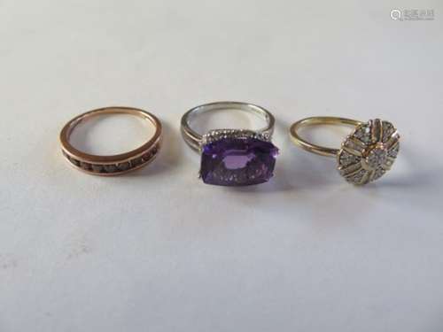 Three 9ct gold rings, amethyst, red diamond and white diamond, sizes M O P, total weight approx 6.