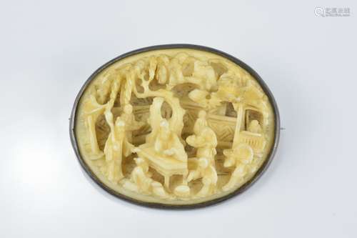 A Chinese 19th century carved ivory brooch