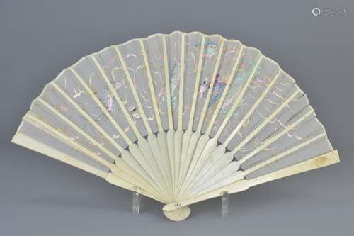 A Japanese early 20th century ivory fan