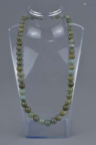 A vintage jade bead necklace