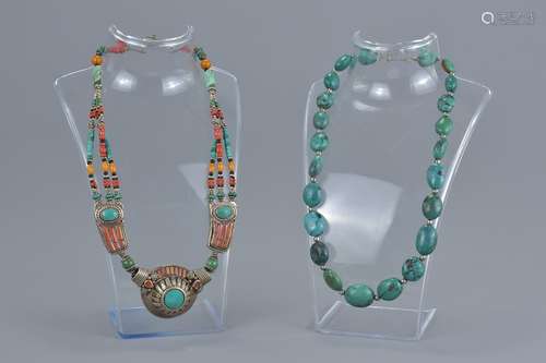 A Tibetan beaded necklace and turquoise beaded necklace