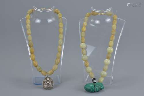 Two jade beaded necklaces with pendants