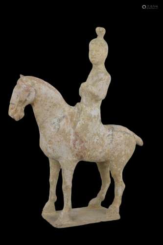 A Chinese Tang dynasty pottery horse and female rider