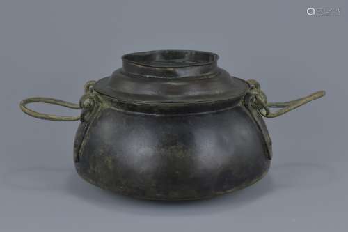 A Chinese Han dynasty bronze cooking pot