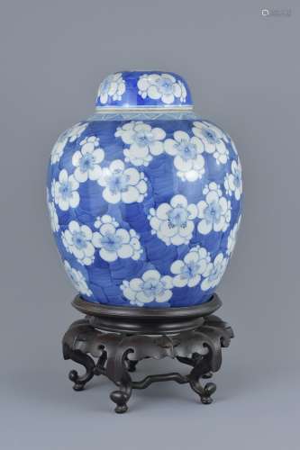 A large Chinese blue and white porcelain ginger jar on stand