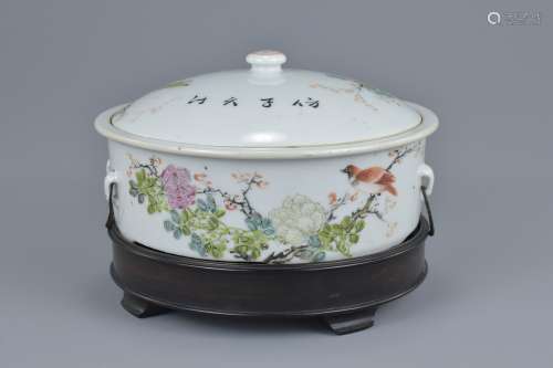A late 19th century porcelain tureen and cover on hardwood stand