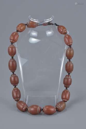 String of Seventeen Polished Agate Stone beads