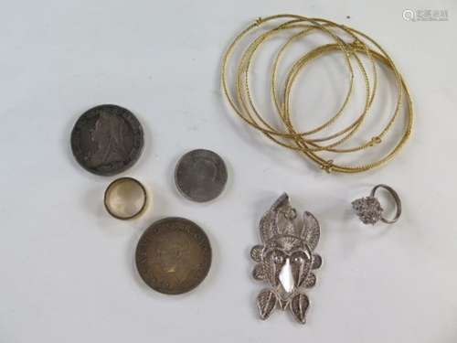 A small amount of silver jewellery, silver coin, half silver coin and yellow metal jewellery,