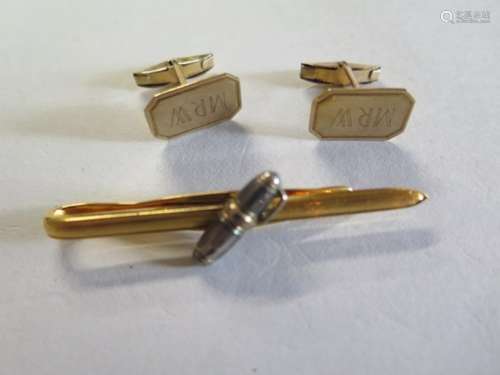 A gold tone Mont Blanc tie pin and a pair of gold plated cuff links, cuff links have initials MRW