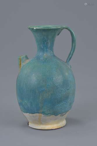 A Persian turquoise glazed pottery ewer