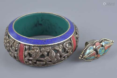 A large Tibetan Bakelite bangle with ring