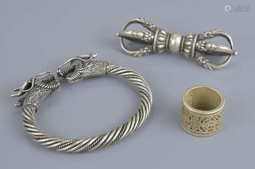 A white metal dragon bangle together with ring