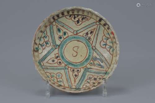 A Middle Eastern painted pottery bowl