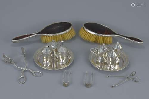 Two antique English silver cruet sets and dishes