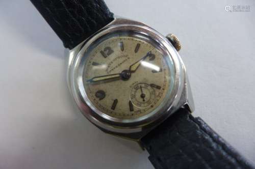 A gents steel case Duchene and Fils Uno wristwatch, raised bezel, silvered face, with Arabic