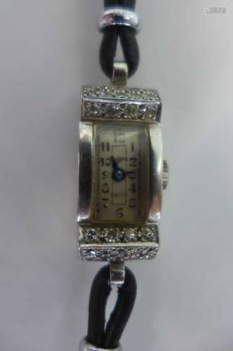 A pretty Art Deco style platinum and diamond Mappin wristwatch, the rectangular case set with 28