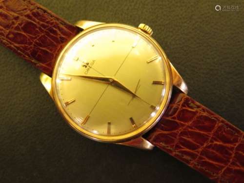 A gents pink or rose 18ct gold Omega Geneve watch with champagne dial, with baton markers and