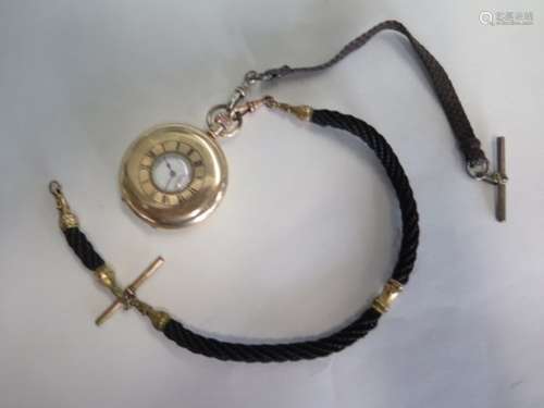 A gold plated half hunter pocket watch on a leather and rope plaited chain, watch running - 5cm