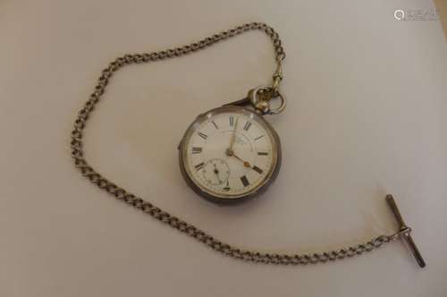 A silver Express English lever pocket watch and silver chain, watch running