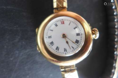 A very fine ladies 15ct gold Edwardian wristwatch, a very early design for a ladies watch, white