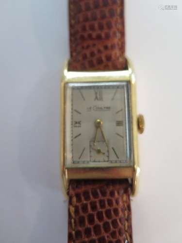 A fine gents Le Coultre 14ct gold wristwatch on lizard strap, rectangular dial marked Le Coultre