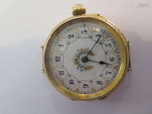 A very nice 18ct gold ladies fob wristwatch, beautiful gilded and decorated white enamel dial with