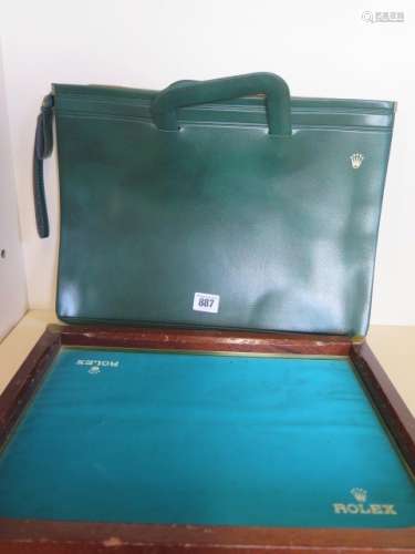 A collection of Rolex memorabilia including a Rolex display tray and Rolex leatherette folder