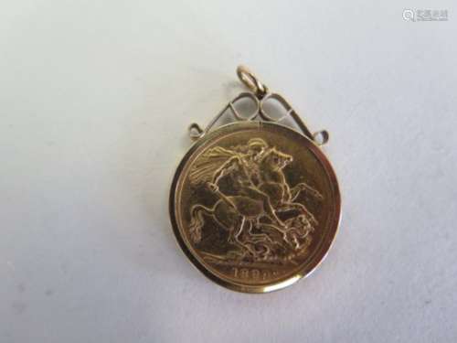 A Victorian sovereign dated 1889- in a 9ct mount, dated 1889 - total weight approx 8.9 grams